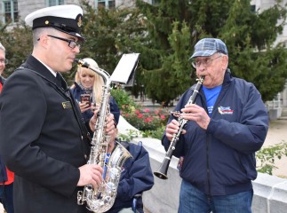 Veteran and Navy band member jamming