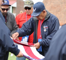 Veterans folding flag at Fort McHenry