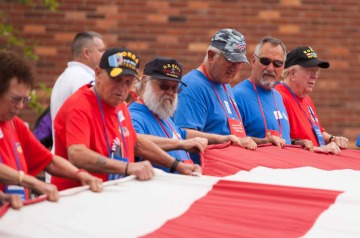 Veterans and Guardians with flag at Fort McHenry