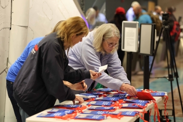 Volunteers organizing neck wallets at the airport